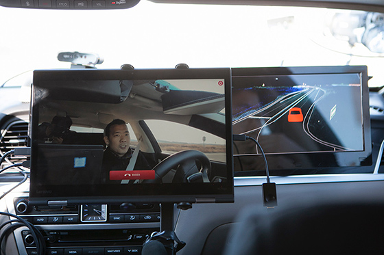 Screens of 5G video call and HD map that were mounted inside a self-driving car