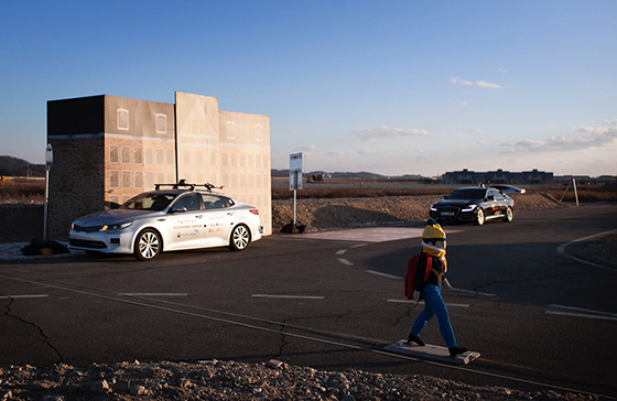 A CCTV spotted a jaywalking kid in a school zone area and ___alerted to a nearby vehicle through 5G network, allowing two self-driving cars to stop all at once